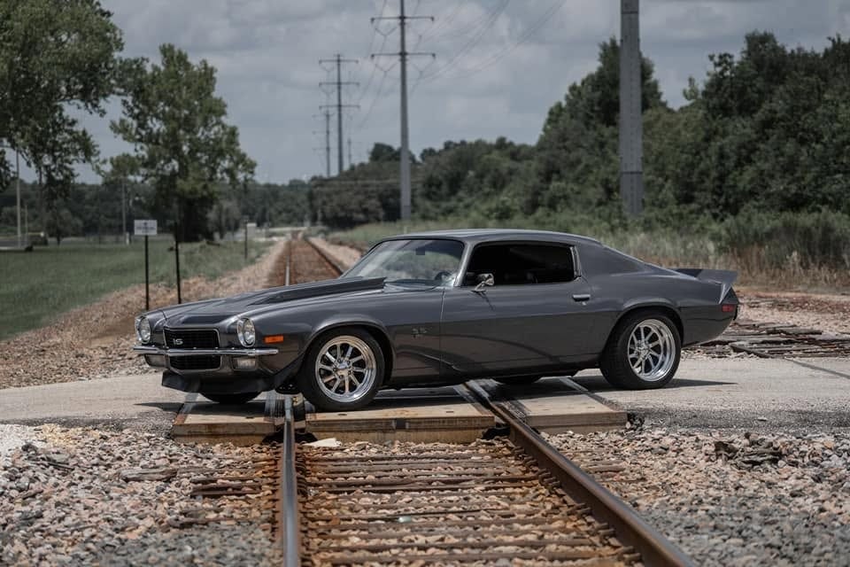 Classic car on lift in automotive workshop